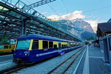 Scenery Of A Train Parking By A Platform Of Lauterbrunnen Station With