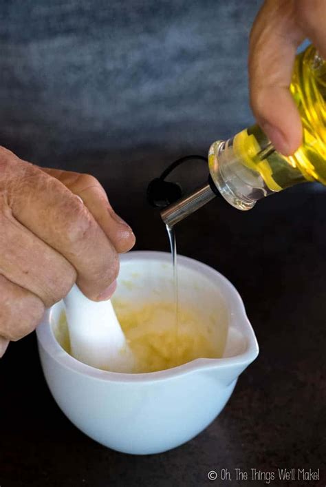 Traditional Aioli Being Made With Only Garlic And Olive Oil With A