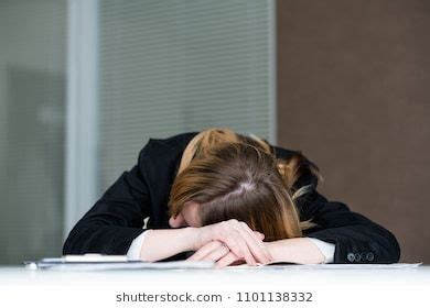 overworking fatigue workaholic. tired business woman laid her head on