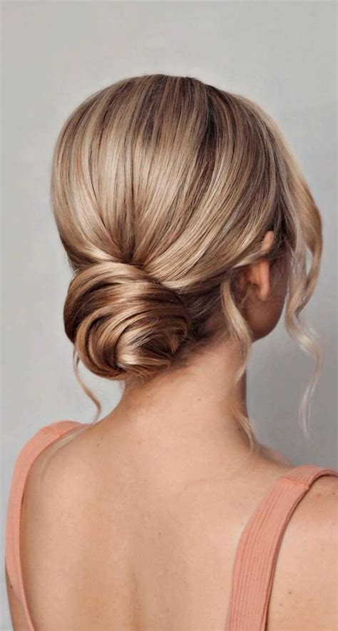 53 Best Wedding Hairstyles For 2023 Brides Classic Twisted Low Bun