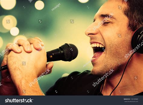 Retro Image Of Man Singing Into Microphone Stock Photo 118109989
