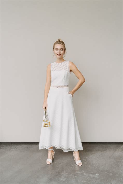Romantisch mit schleppe in der kirche oder lieber mit kurzer silhouette und bunten accessoires im standesamt? Brautkleid mit Taschen, vorne kurz und hinten lang - Olivia