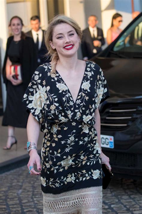 Amber Heard In A Black Floral Dress Arrives At The Martinez Hotel