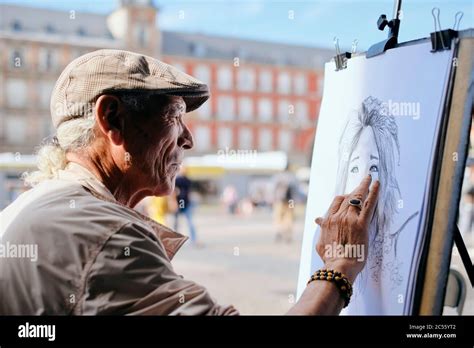 Old Male Street Painter Drawing Portrait Of Tourist Stock Photo Alamy