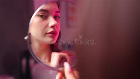 Beautiful Girl With Perfect Skin Face Looks Herself In Mirror In Beauty