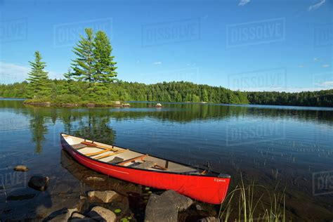 Red Canoe On Little Island Lake Algonquin Park Ontario Stock Photo