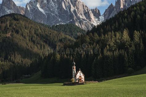 Sunny Landscape Of Dolomite Alps With St Johann Church And Mountains In
