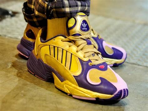These come with a white and purple upper, three white stripes outlined in purple, and a white and purple sole. Adidas Falcon Yung-1 DBZ Golden Freezer