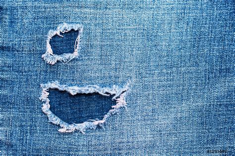 Hole On Denim Jeans Ripped Destroyed Torn Blue Jeans Background Stock