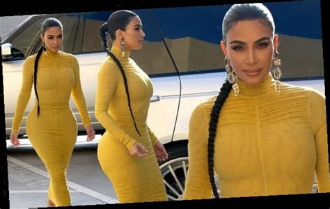 kim kardashian puts her curves on display in very tight yellow dress