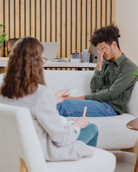 Young Man In Consultation With Psychologist Is Taking Care Of Mental