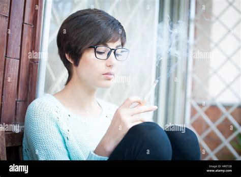 Young Pretty Woman Smoking And Relaxing Outdoor Stock Photo Alamy