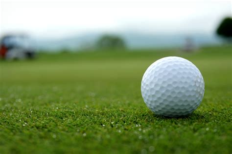 White Golf Ball On Green Grass Field · Free Stock Photo