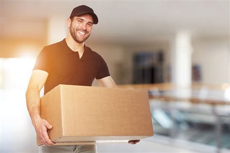 Happy Delivery Man With Box Stock Photo Download Image Now Istock