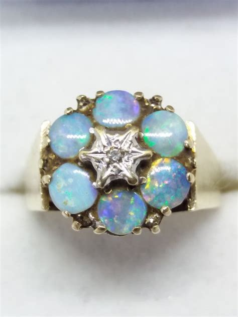 Australian Blue Boulder Opals With Centre Diamond In High Gold Setting