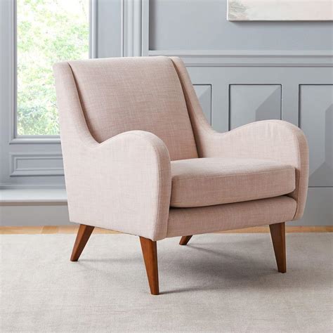 Looking at the chair from the front, it's much deeper and more narrow than it appears, imbuing it with a kind of sneaky coziness. Sebastian Chair | west elm UK