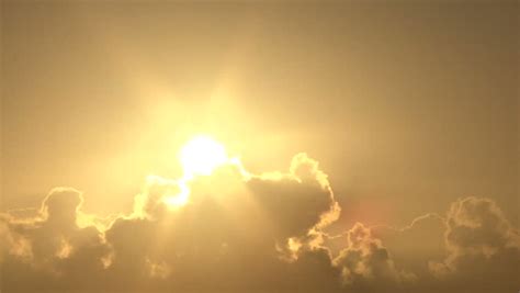 Close Up Of Bright Shining Sun Rising Above Clouds Stock Footage Video