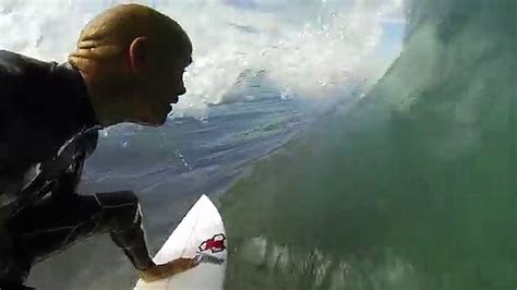 kelly slater posts video riding a wave close to a great white shark in