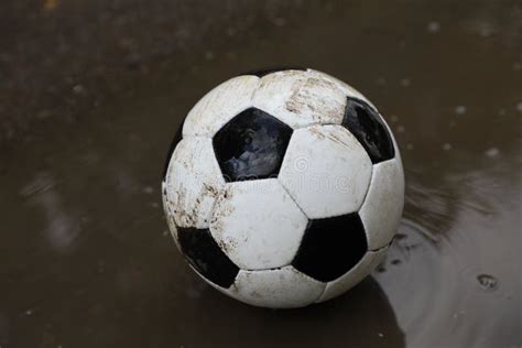 Dirty Soccer Ball Near Puddle Outdoors Closeup Stock Image Image Of