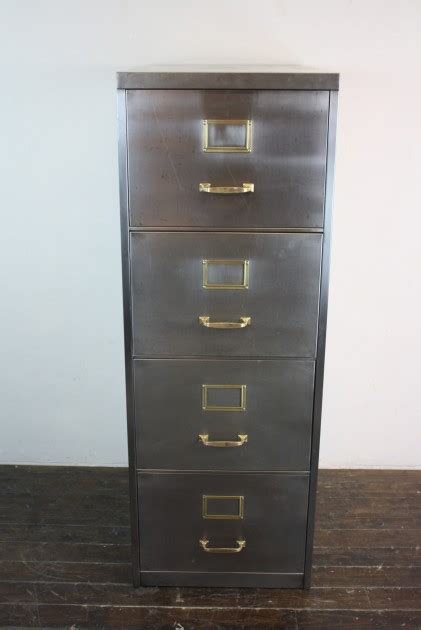 Add file folders into the sleeves in an appropriate filing category. Vintage polished steel 4 drawer filing cabinet with brass ...