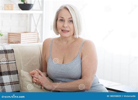 Active Beautiful Middle Aged Woman Smiling Friendly And Looking Into