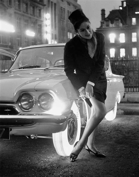 A Woman Adjusting Her Stockings By The Light Of A Goodyear Illuminated Tire 1961 659x730 R