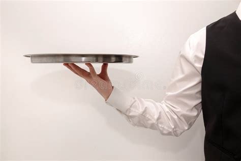 A Waiter Butler Carrying An Empty Silver Tray Stock Image Image Of