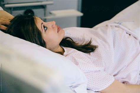 Young Woman Lying On Hospital Bed Stocksy United