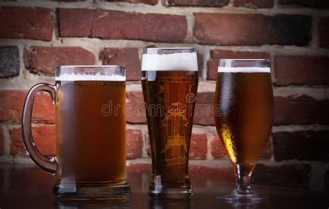 Close Up Of A Rack Of Different Kinds Of Beers Dark To Light On A
