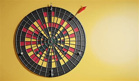 Premium Ai Image Aiming For Success Dartboard With Arrow On Yellow