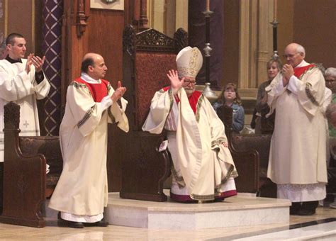 the catholic post priests renew vows holy oils are blessed during chrism mass at cathedral