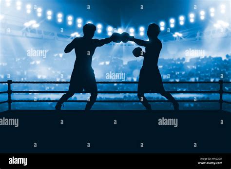 Silhouette Of Two Professional Asian Boxer Fight In The Boxing Match