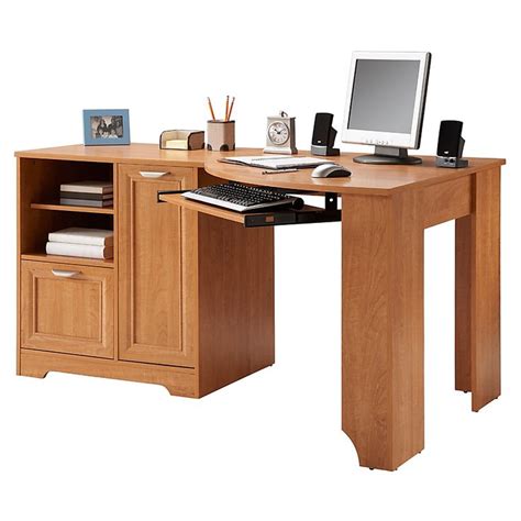 This desk is built with a nice strong oak, plus there's plenty of room for storage thanks to the three drawers and the cabinet on the sides. Realspace Magellan Collection Corner Desk 30 H x 59 12 W x ...