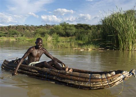 Fisherman Paddling A Traditional Boat On Lake Baringo Kenya Kenya