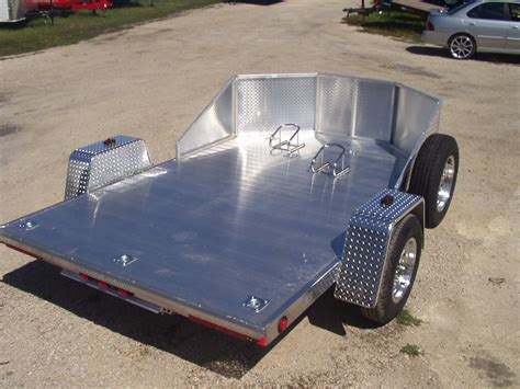 The straps should be attached in the four corners. R and R All Aluminum OMC2 Open Motorcycle Trailer