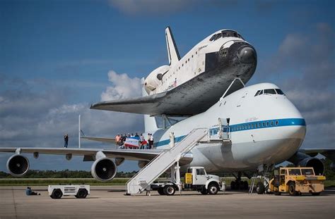 Workers Pose For A Photograph On The Wing Of Nasas Shuttle Carrier