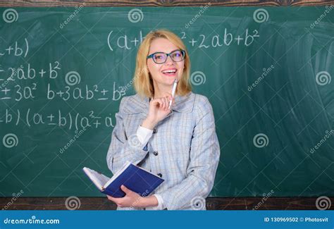 Qualities That Make Good Teacher Woman Teaching Near Chalkboard Stock