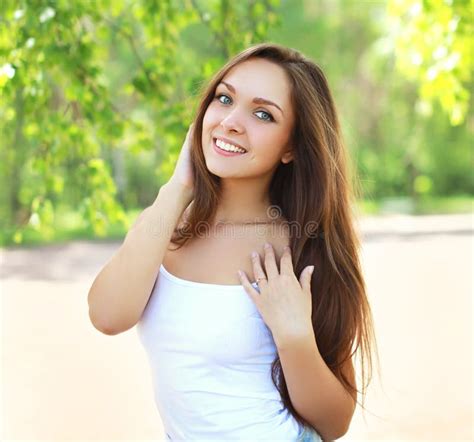 Outdoor Portrait Of Pretty Young Girl In Sunny Summer Stock Photo