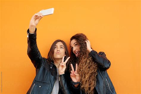Funny Girlfriends Taking Selfie By Stocksy Contributor Guille