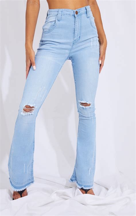 Light Blue Wash Distressed Knee Flare Jeans Prettylittlething Usa