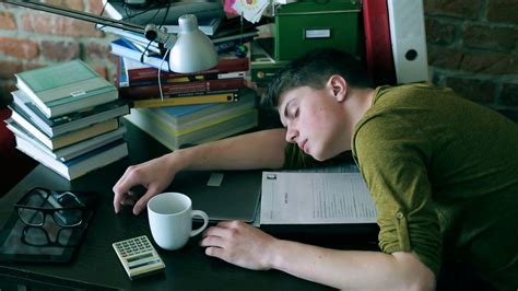 Tired Student Sleeping On Desk Notes At Home Stock Footage Sbv