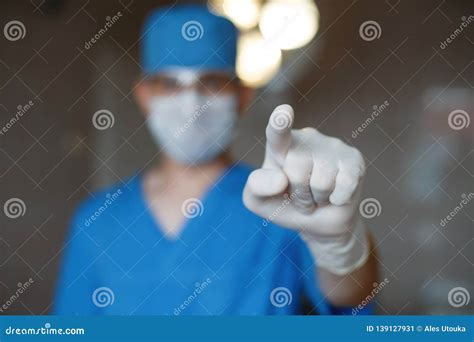 Surgeon Stands In The Operating Room And Checks The Patient S Health Doctor Shows A Finger