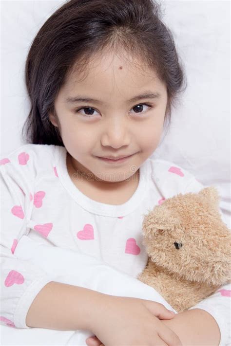 adorable little asian girl sleep with bear doll stock image image of bear home 51392681