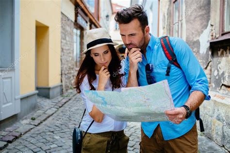 Lost Tourists Reading Map Stock Photo By ©baranq 115184624