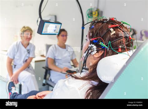 Young Woman Undergoing An Electroencephalogram Eeg Epilepsy Screening Angouleme Hospital