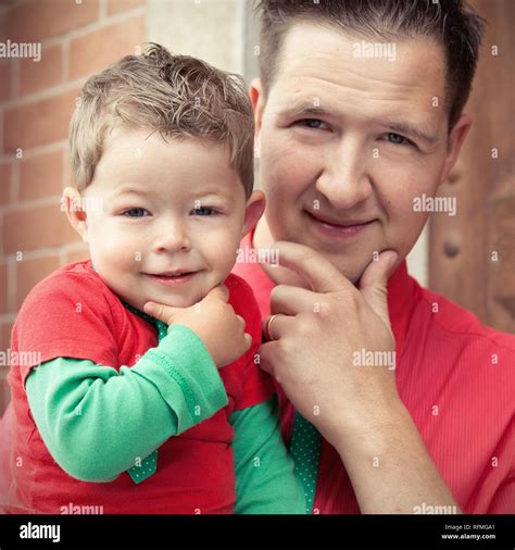 Father And Son In The Same Pose Stock Photo Alamy