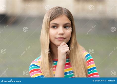 Portrait Of Pondering Teen Girl With Blonde Hair Portrait Of Teen Girl