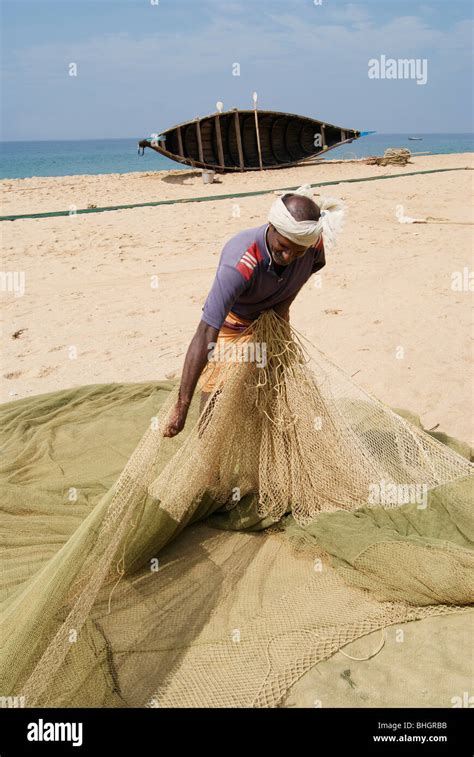 Fisherman Arranging Fishing Net Stock Photo Alamy