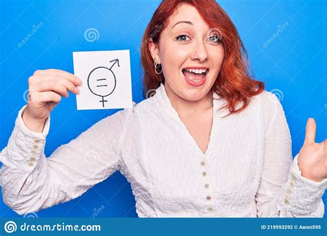 Young Redhead Woman Asking For Sex Discrimination Holding Paper With Gender Equality Message