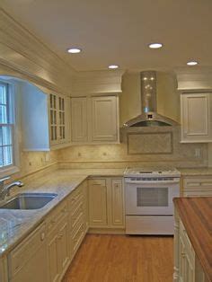 If you have a large kitchen with large soffits than add molding. Hide kitchen soffit with molding and crown molding ...